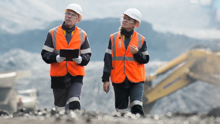 Two workers on a worksite